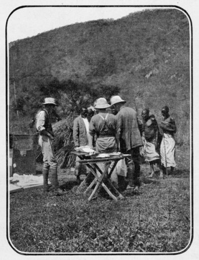 Discussing the Situation: a Conference in Camp, from an article entitled To the Mountains of the Moon published in The Graphic October 27th 1906 by English Photographer